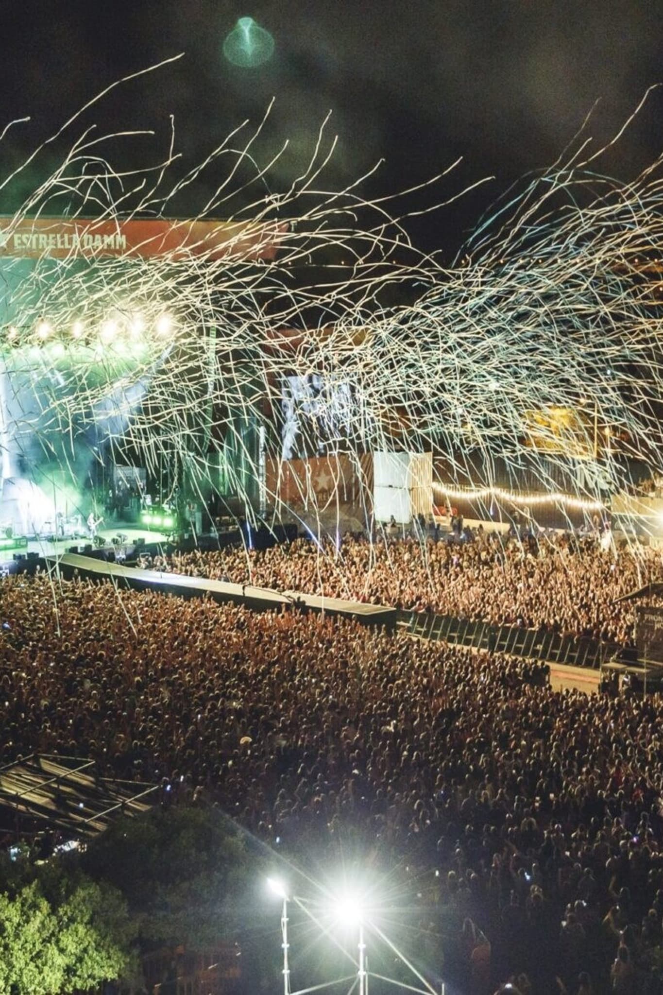 Large outdoor festival audience at sunset
